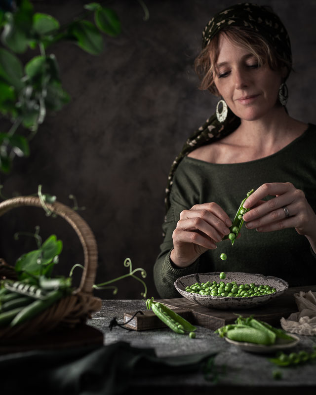 Julia Wharington shelling peas in an idyllic scene