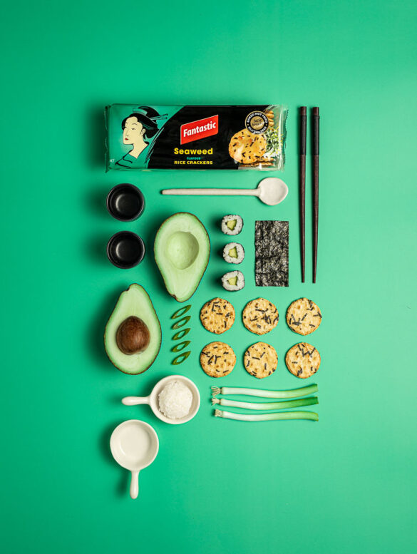 Knolled arrangement of Fantastic Rice Crackers Seaweed with sushi, avocado
