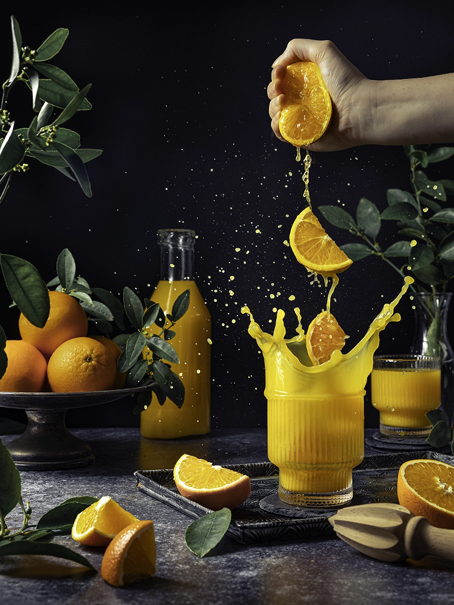 glass of orange juice with a big splash